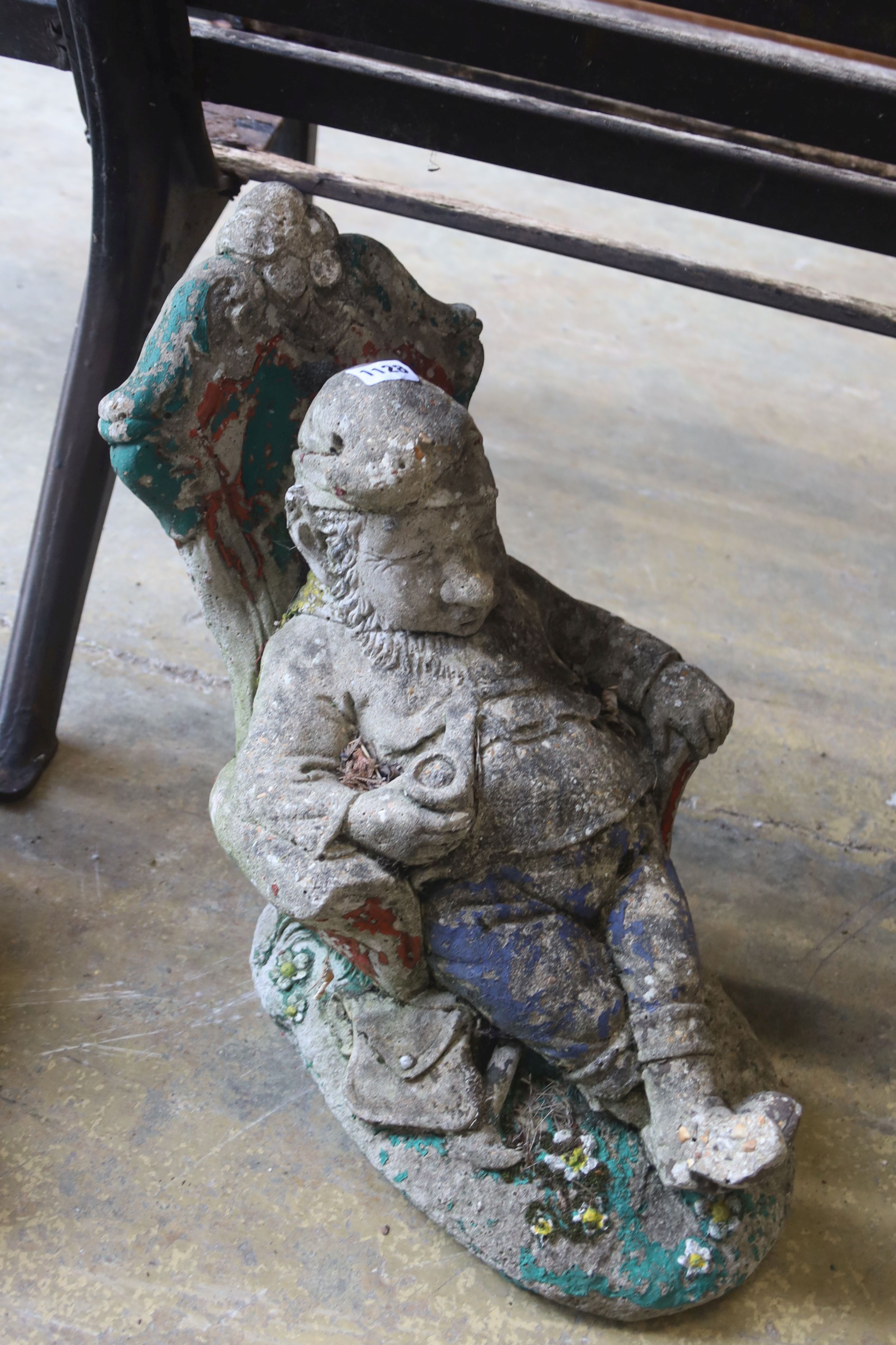 A pair of reconstituted garden ornaments modelled as seated gnomes, height 40cm